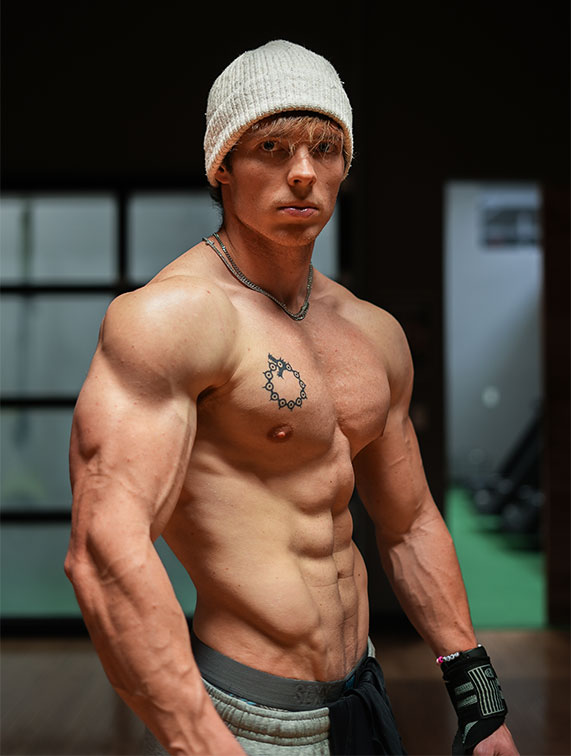 Coach posing with his muscular torso